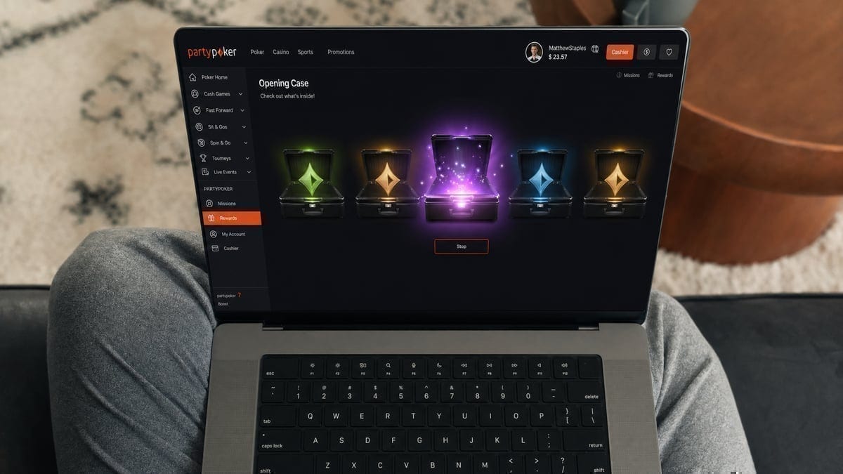 Player opening PartyPoker reward case on laptop